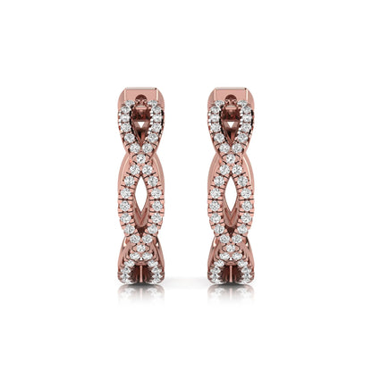Infinity pavé lab grown diamond huggie hoop earrings featuring round brilliant diamonds in an open infinity design with additional pavé diamonds on a rose gold hinged hoop.