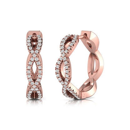 Infinity pavé lab grown diamond huggie hoop earrings featuring round brilliant diamonds in an open infinity design with additional pavé diamonds on a rose gold hinged hoop.