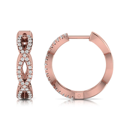 Infinity pavé lab grown diamond huggie hoop earrings featuring round brilliant diamonds in an open infinity design with additional pavé diamonds on a rose gold hinged hoop.