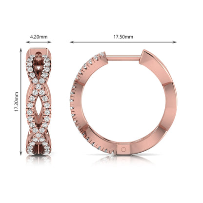 Infinity pavé lab grown diamond huggie hoop earrings featuring round brilliant diamonds in an open infinity design with additional pavé diamonds on a rose gold hinged hoop.