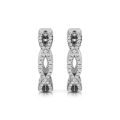 Infinity pavé lab grown diamond huggie hoop earrings featuring round brilliant diamonds in an open infinity design with additional pavé diamonds on a white gold hinged hoop.