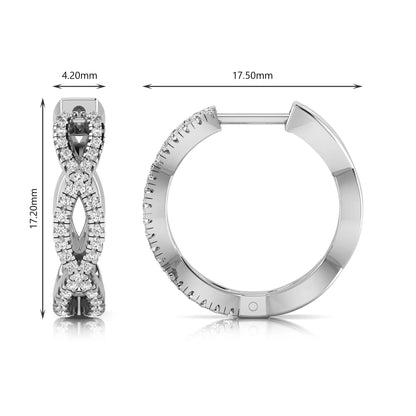 Infinity pavé lab grown diamond huggie hoop earrings featuring round brilliant diamonds in an open infinity design with additional pavé diamonds on a white gold hinged hoop.