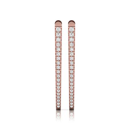 Inside-out round cut lab grown diamond hoop earrings with shared prong setting, elongated oval silhouette, hinged snap closure, and rose gold tone.