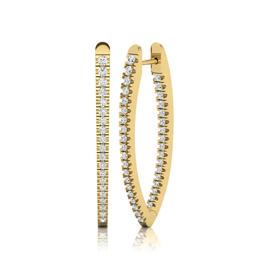Inside-out round cut lab grown diamond hoop earrings with shared prong setting, elongated oval silhouette, hinged snap closure, and yellow gold tone.