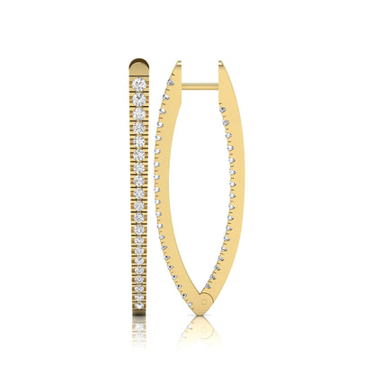 Inside-out round cut lab grown diamond hoop earrings with shared prong setting, elongated oval silhouette, hinged snap closure, and yellow gold tone.