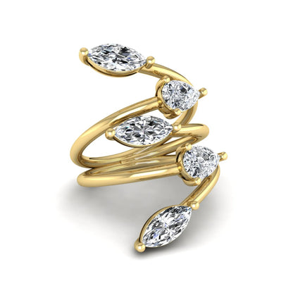Marquise and pear cut lab grown diamond bypass wrap ring featuring alternating diamonds in a flowing yellow gold tone prong setting.