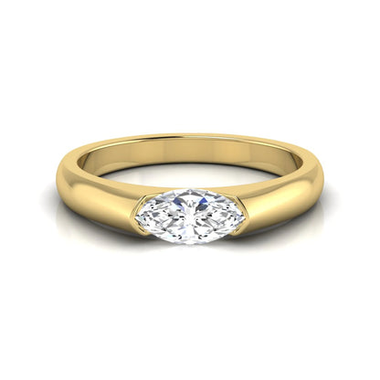 Marquise cut lab grown diamond engagement ring with bezel setting and polished yellow gold tone tapered band