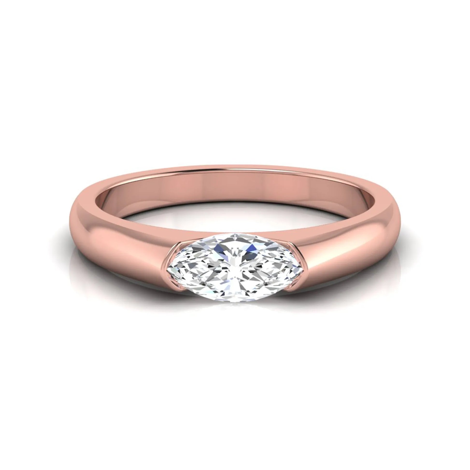 Marquise cut lab grown diamond engagement ring with bezel setting and polished rose gold tone tapered band