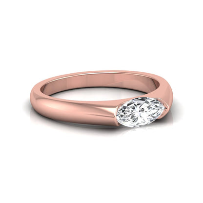 Marquise cut lab grown diamond engagement ring with bezel setting and polished rose gold tone tapered band
