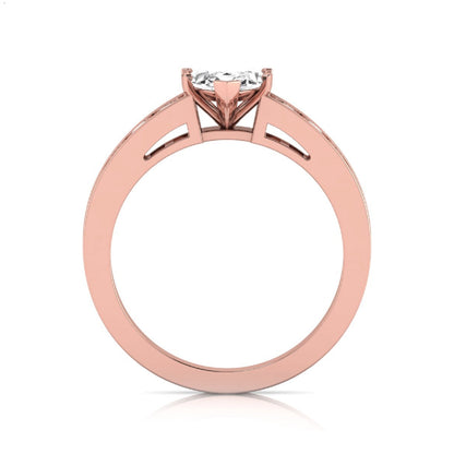 Marquise cut lab grown diamond engagement ring featuring a 0.95 carat IGI certified center diamond with channel set round side diamonds in rose gold.