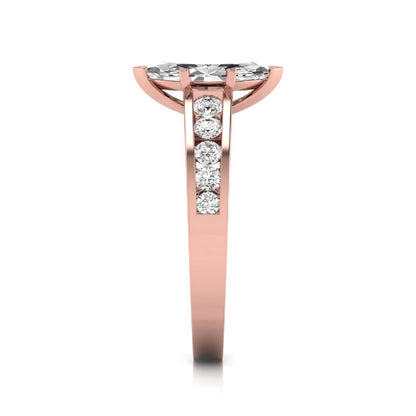 Marquise cut lab grown diamond engagement ring featuring a 0.95 carat IGI certified center diamond with channel set round side diamonds in rose gold.