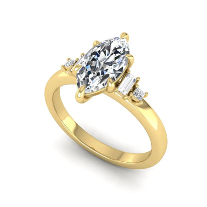 IGI certified marquise cut lab grown diamond five stone engagement ring with baguette and princess cut side diamonds in yellow gold.