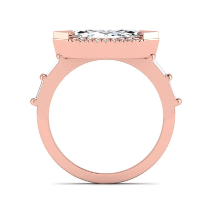 Marquise cut lab grown diamond halo engagement ring with round halo, baguette side diamonds, and rose gold tone band.