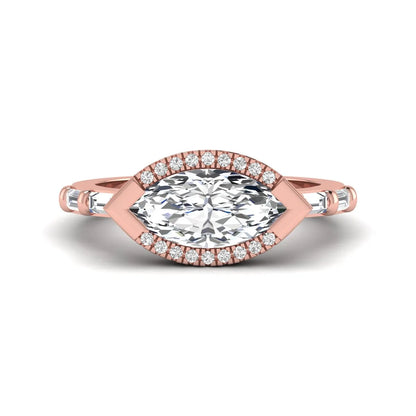 Marquise cut lab grown diamond halo engagement ring with round halo, baguette side diamonds, and rose gold tone band.