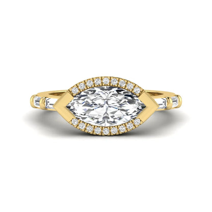 Marquise cut lab grown diamond halo engagement ring with round halo, baguette side diamonds, and yellow gold tone band.