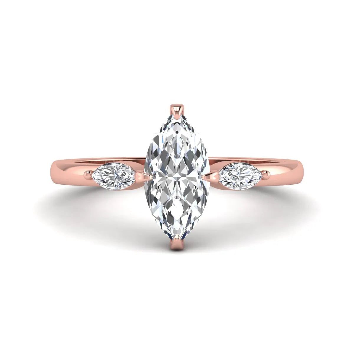 Marquise cut lab grown diamond three stone engagement ring featuring a 1.62 carat IGI certified center diamond with marquise side diamonds in rose gold.