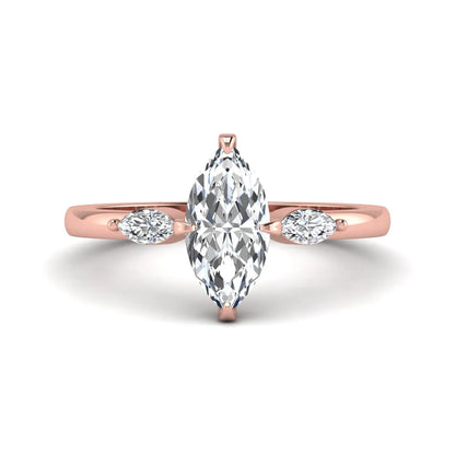 Marquise cut lab grown diamond three stone engagement ring featuring a 1.62 carat IGI certified center diamond with marquise side diamonds in rose gold.