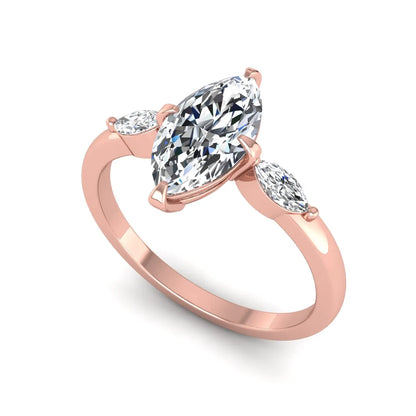 Marquise cut lab grown diamond three stone engagement ring featuring a 1.62 carat IGI certified center diamond with marquise side diamonds in rose gold.