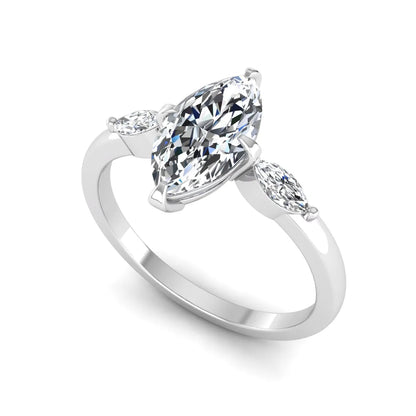 Marquise cut lab grown diamond three stone engagement ring featuring a 1.62 carat IGI certified center diamond with marquise side diamonds in white gold.