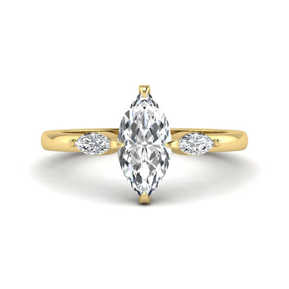 Marquise cut lab grown diamond three stone engagement ring featuring a 1.62 carat IGI certified center diamond with marquise side diamonds in yellow gold.