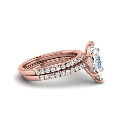 Marquise cut lab grown diamond bridal ring set featuring a pavé solitaire engagement ring with matching diamond wedding band in rose gold.