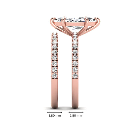 Marquise cut lab grown diamond bridal ring set featuring a pavé solitaire engagement ring with matching diamond wedding band in rose gold.