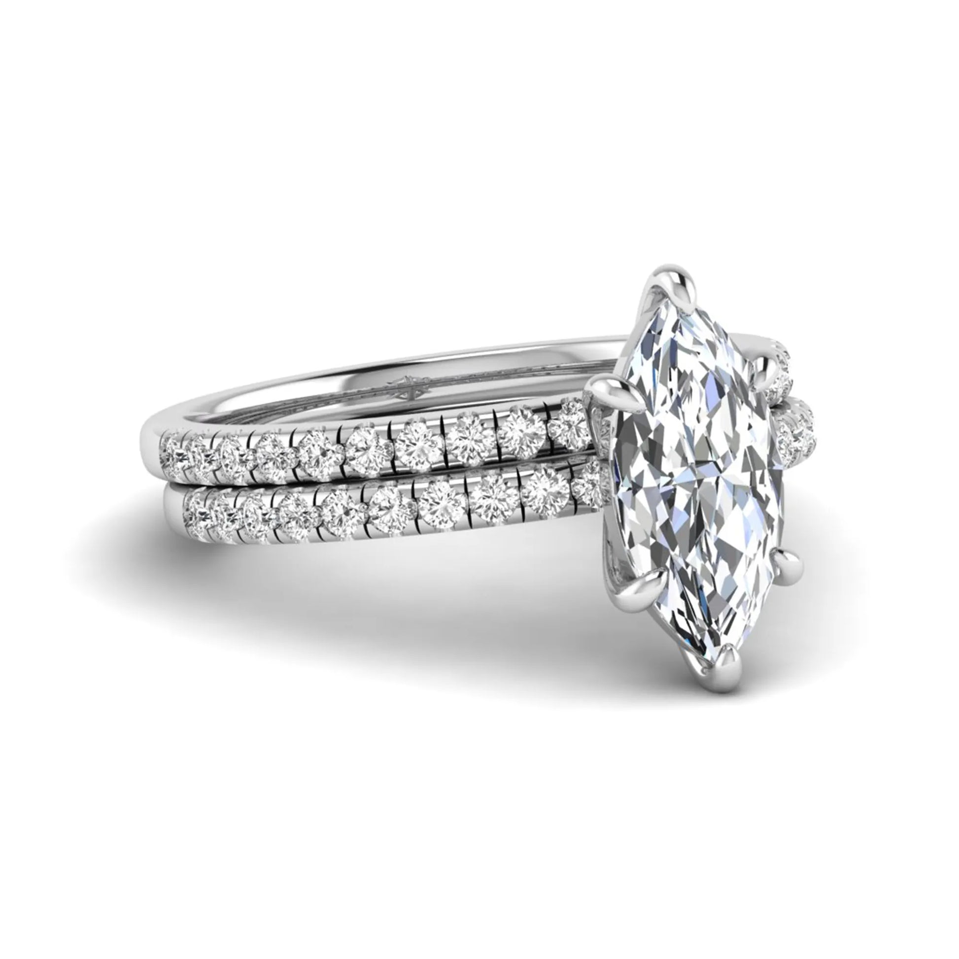 Marquise cut lab grown diamond bridal ring set featuring a pavé solitaire engagement ring with matching diamond wedding band in white gold.