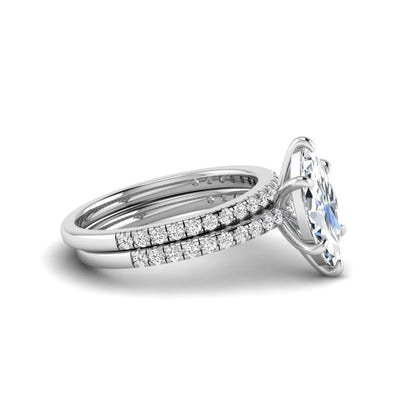 Marquise cut lab grown diamond bridal ring set featuring a pavé solitaire engagement ring with matching diamond wedding band in white gold.