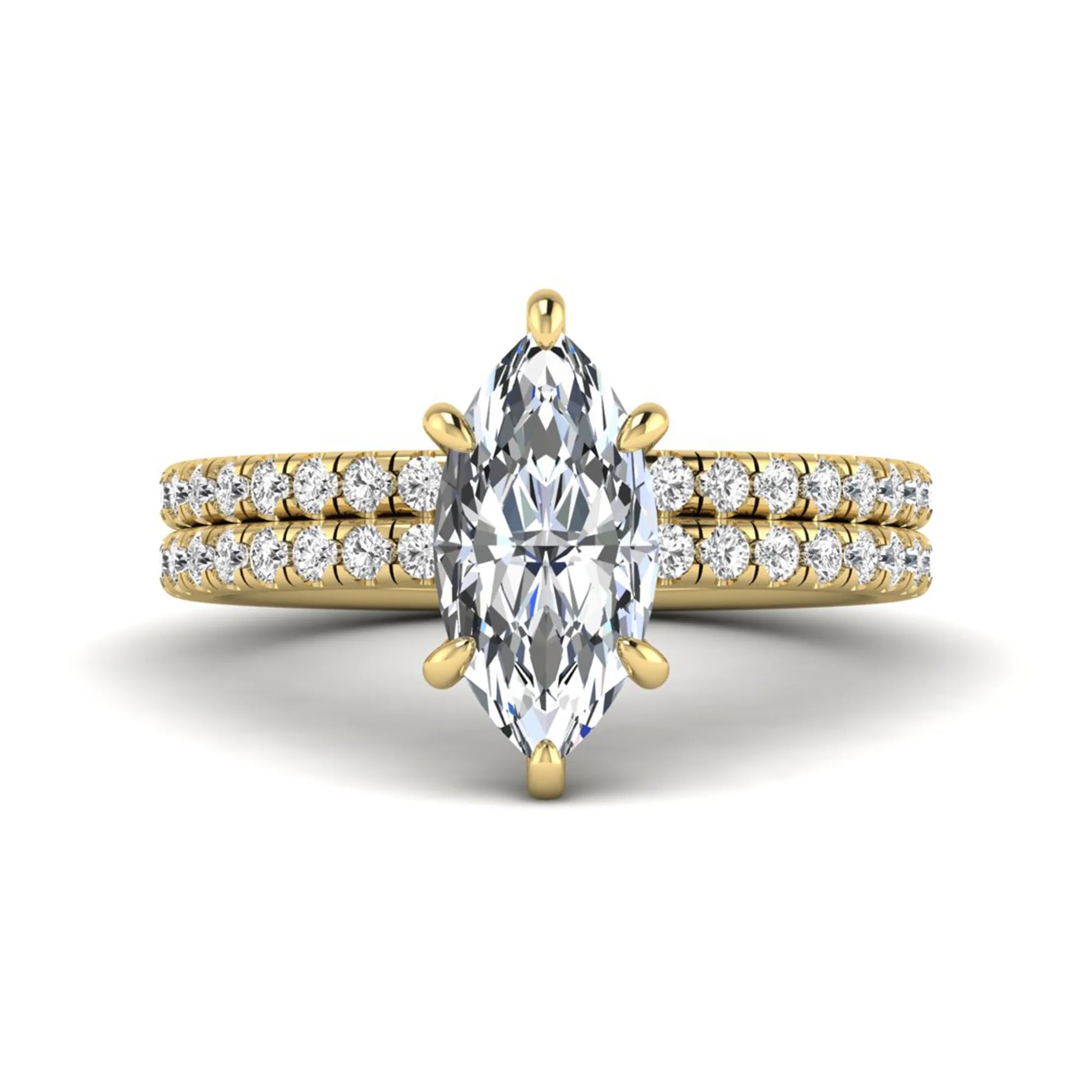 Marquise cut lab grown diamond bridal ring set featuring a pavé solitaire engagement ring with matching diamond wedding band in yellow gold.