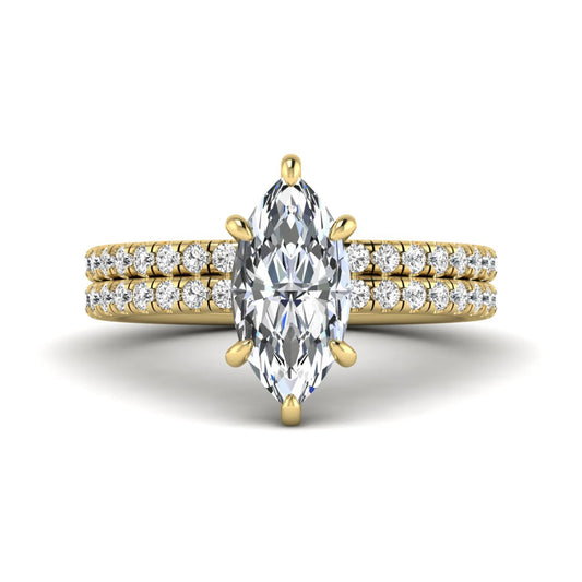 Marquise cut lab grown diamond bridal ring set featuring a pavé solitaire engagement ring with matching diamond wedding band in yellow gold.