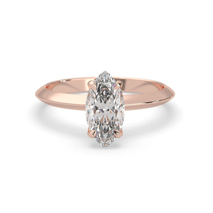 Rose-gold ring with a marquise-shaped diamond on a white background