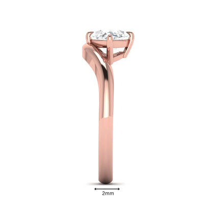 Marquise cut lab grown diamond solitaire engagement ring featuring a four prong cathedral setting with a polished 2 mm band in rose gold tone.