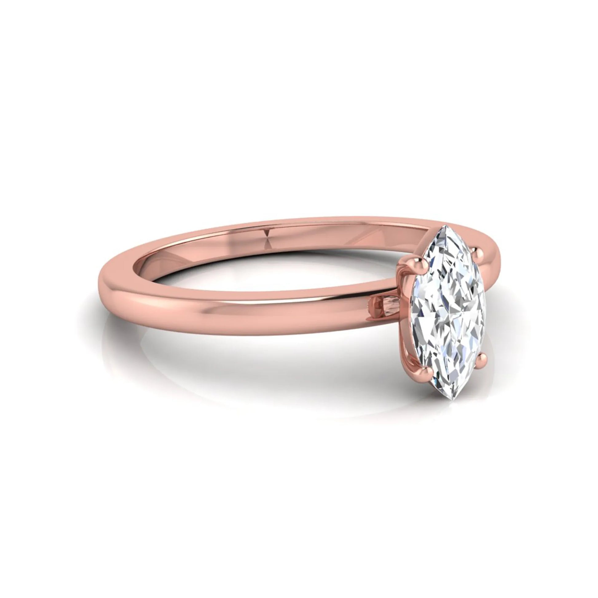 Marquise cut lab grown diamond solitaire engagement ring with four prong setting on rose gold tone band