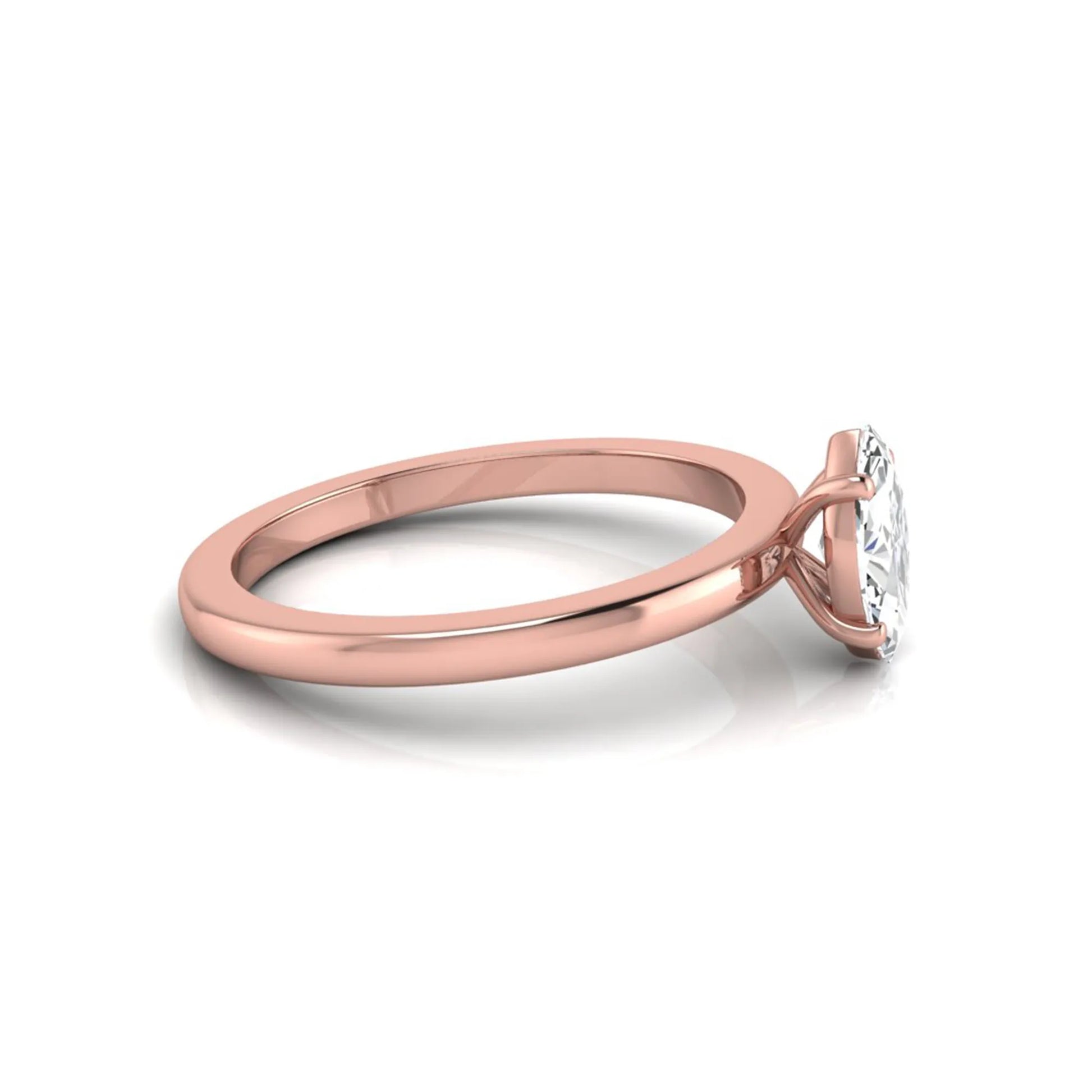 Marquise cut lab grown diamond solitaire engagement ring with four prong setting on rose gold tone band