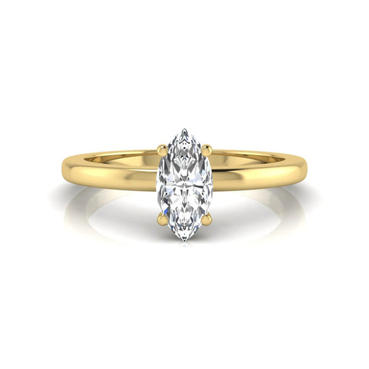 Marquise cut lab grown diamond solitaire engagement ring with four prong setting on yellow gold tone band