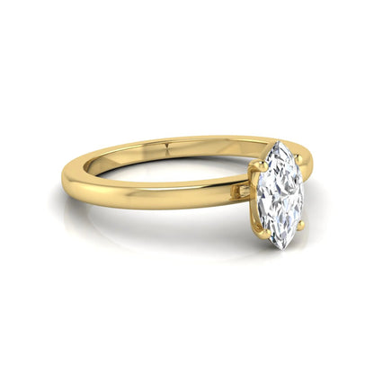 Marquise cut lab grown diamond solitaire engagement ring with four prong setting on yellow gold tone band