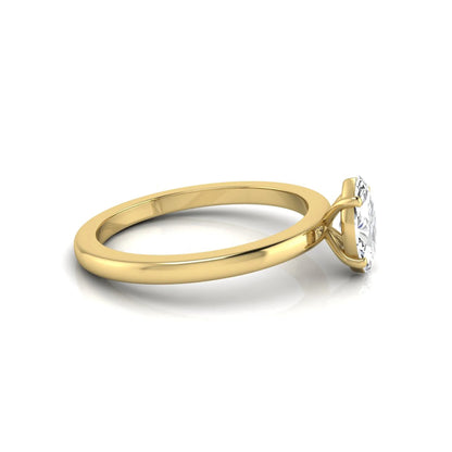 Marquise cut lab grown diamond solitaire engagement ring with four prong setting on yellow gold tone band