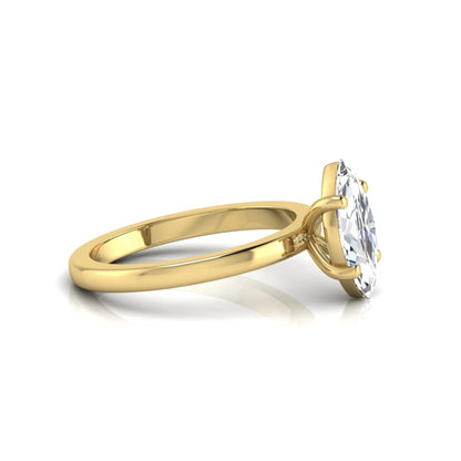 Marquise cut four prong lab grown diamond solitaire engagement ring with yellow gold tone design