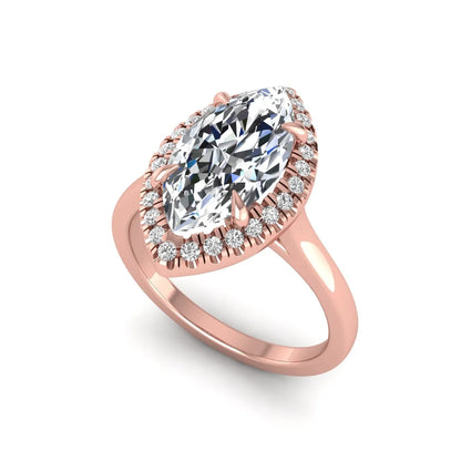 Marquise cut lab grown diamond halo engagement ring with round accent diamonds in a classic prong halo setting in rose gold