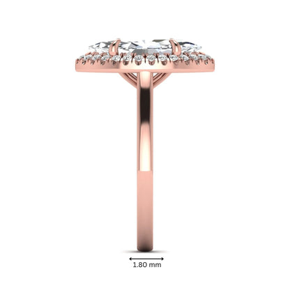 Marquise cut lab grown diamond halo engagement ring with round accent diamonds in a classic prong halo setting in rose gold