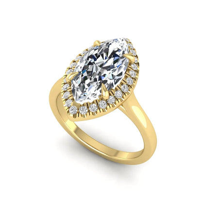 Marquise cut lab grown diamond halo engagement ring with round accent diamonds in a classic prong halo setting in yellow gold