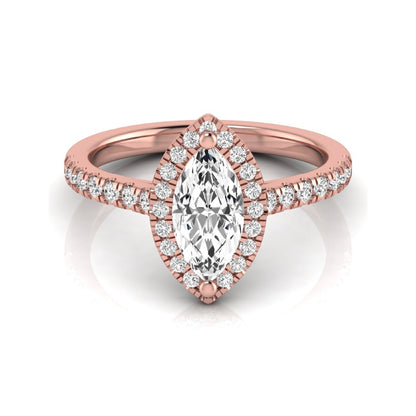 Marquise cut lab grown diamond engagement ring featuring a round diamond halo, pavé diamond band, and classic prong setting with a polished rose gold tone band.