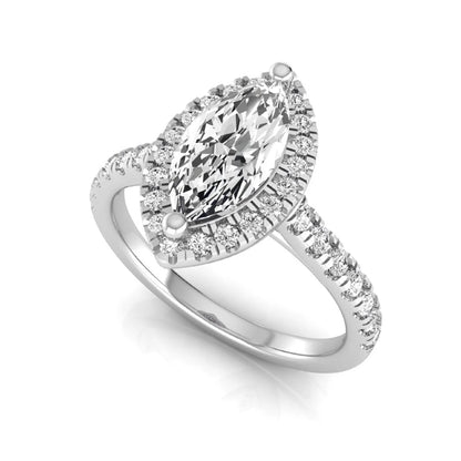 Marquise cut lab grown diamond engagement ring featuring a round diamond halo, pavé diamond band, and classic prong setting with a polished white gold tone band.
