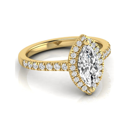 Marquise cut lab grown diamond engagement ring featuring a round diamond halo, pavé diamond band, and classic prong setting with a polished yellow gold tone band.