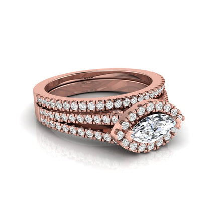 Marquise cut lab grown diamond halo engagement ring set with split shank design and matching pavé diamond wedding band in rose gold.