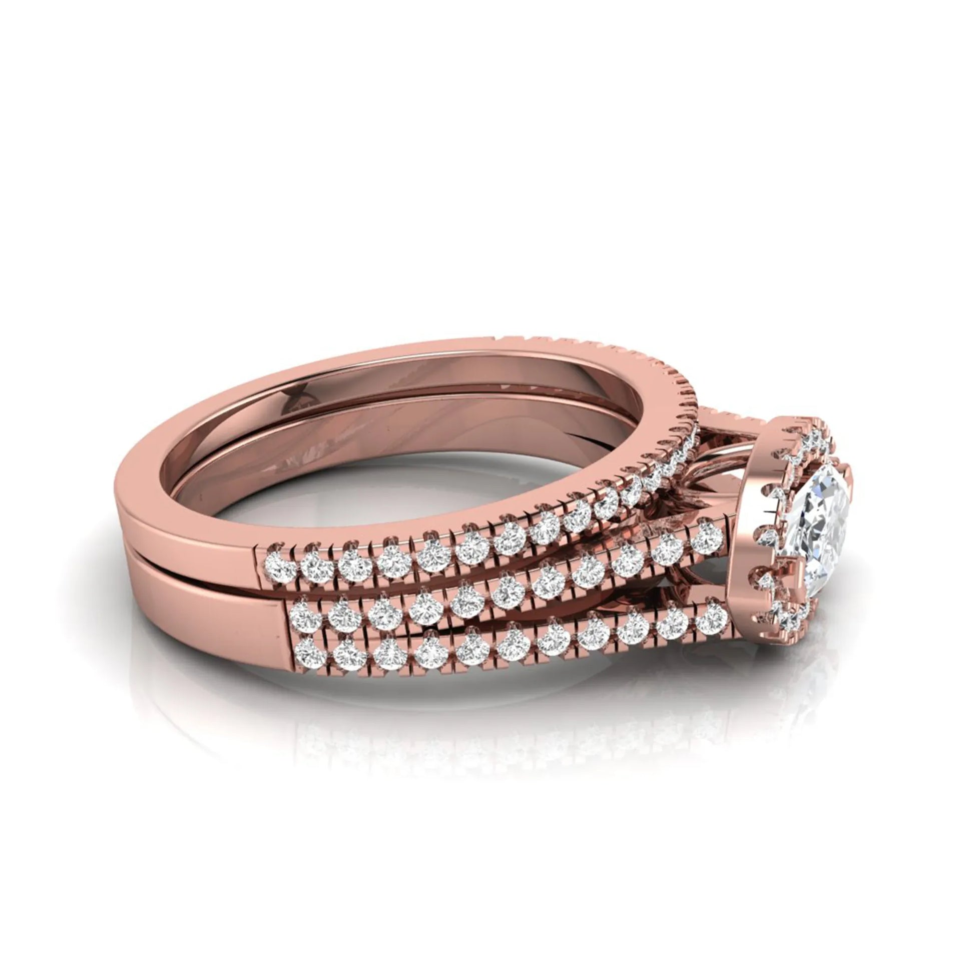 Marquise cut lab grown diamond halo engagement ring set with split shank design and matching pavé diamond wedding band in rose gold.