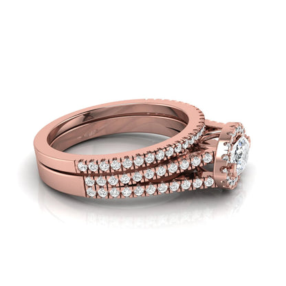 Marquise cut lab grown diamond halo engagement ring set with split shank design and matching pavé diamond wedding band in rose gold.