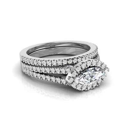 Marquise cut lab grown diamond halo engagement ring set with split shank design and matching pavé diamond wedding band in white gold.