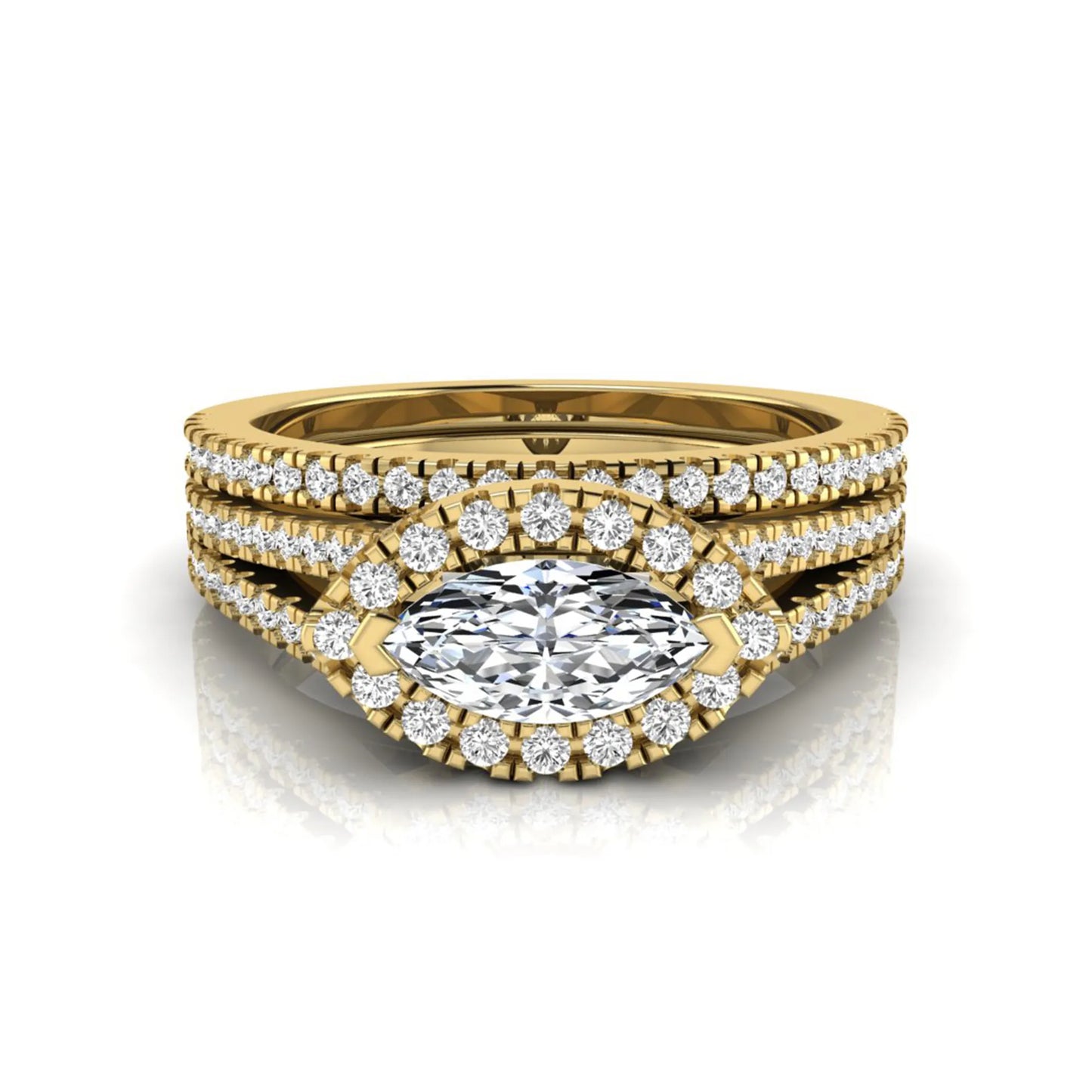 Marquise cut lab grown diamond halo engagement ring set with split shank design and matching pavé diamond wedding band in yellow gold.