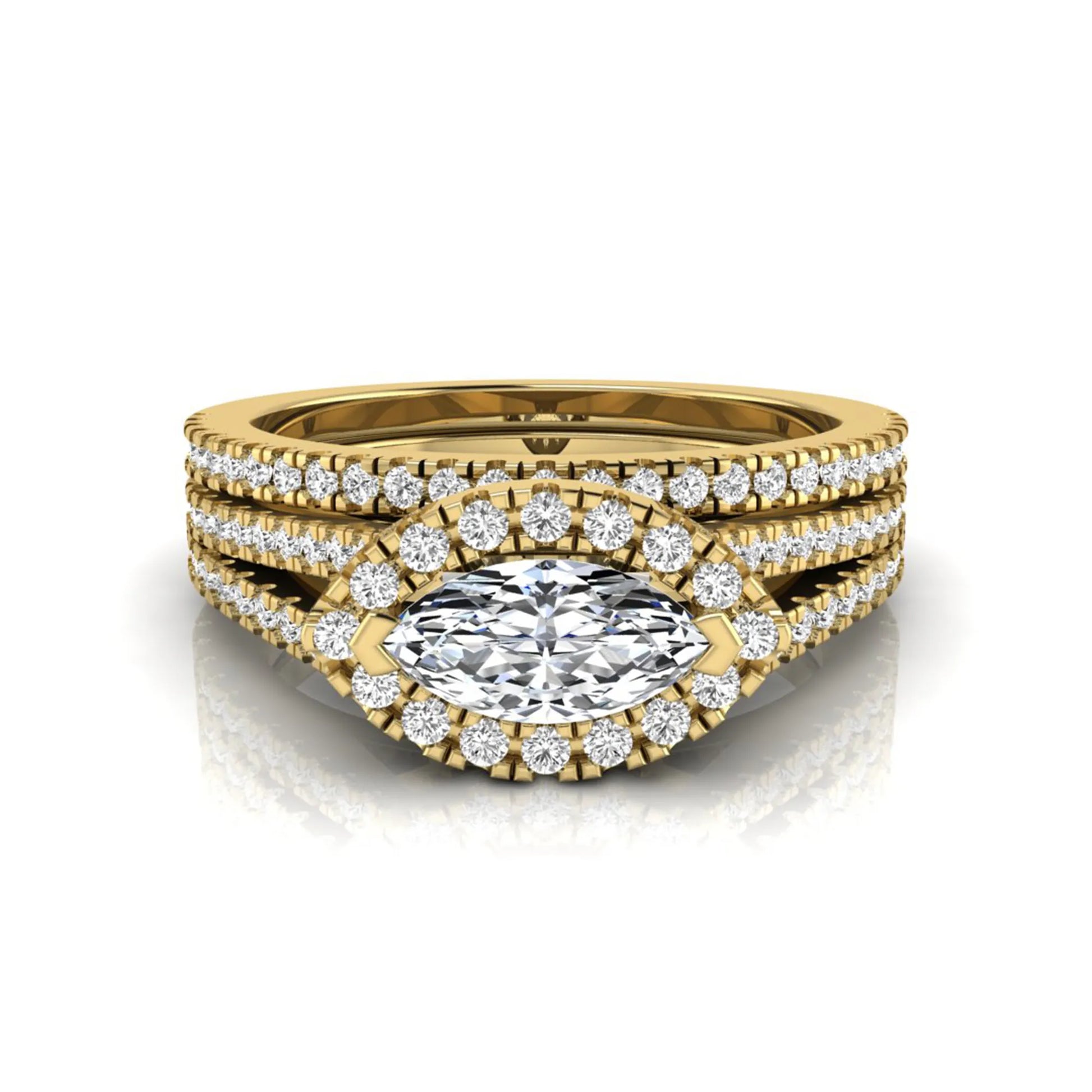 Marquise cut lab grown diamond halo engagement ring set with split shank design and matching pavé diamond wedding band in yellow gold.